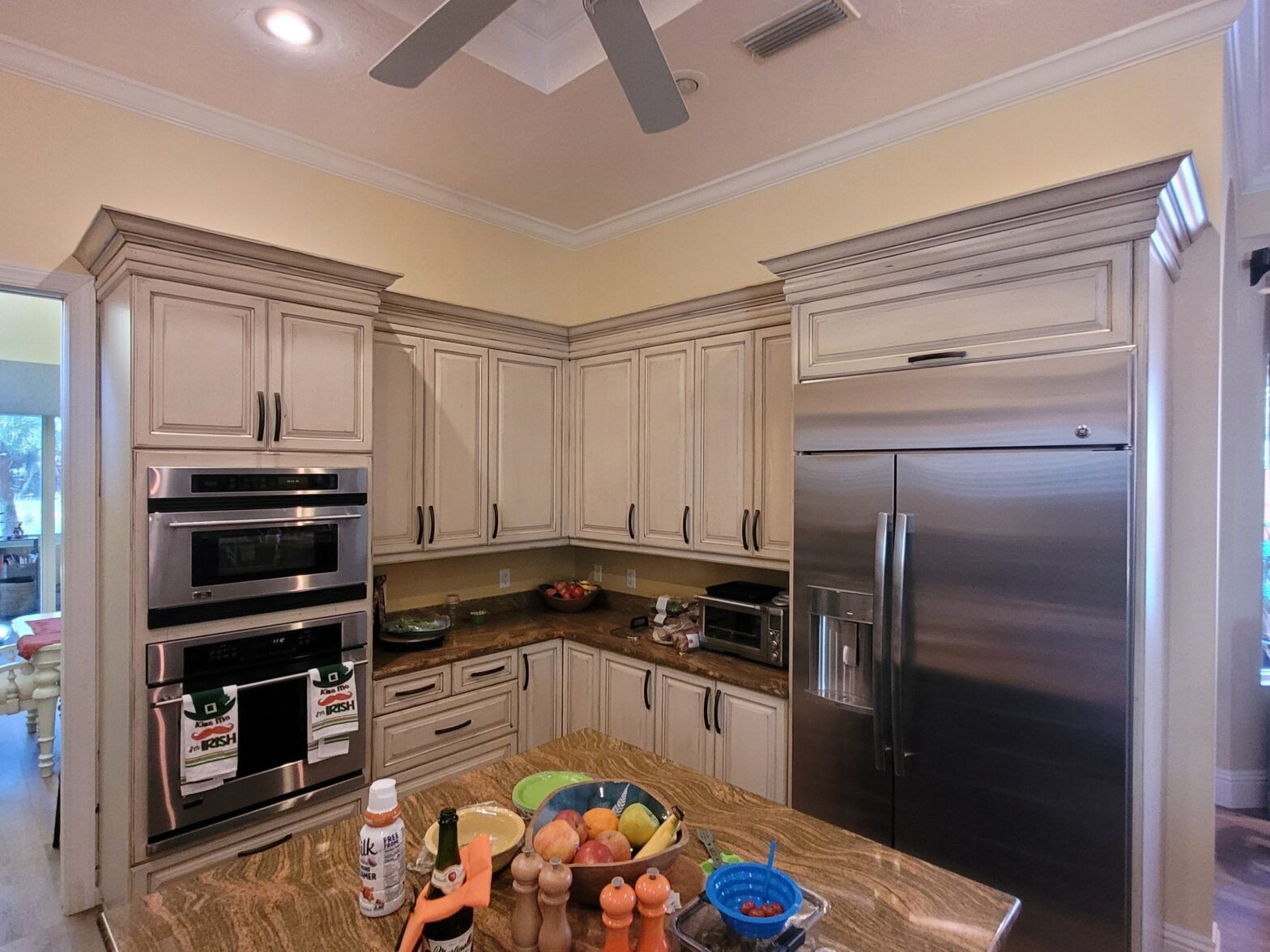 refinished cabinets with pinstriping detail and glaze